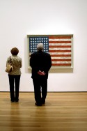 Visitors at the Museum of Modern Art in New York admire Flag by Jasper Johns, Photo by Leo Reynolds, Flickr, Creative Commons Attribution License.