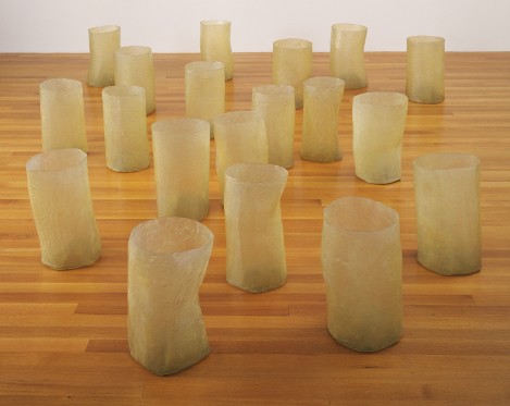 Eva Hesse, Repetition Nineteen III, 1968, fiberglass and polyester resin, nineteen units, Each 19 to 20 1/4" x 11 to 12 3/4" in diameter, MoMA, New York.